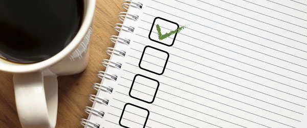Check-list and cup of coffee